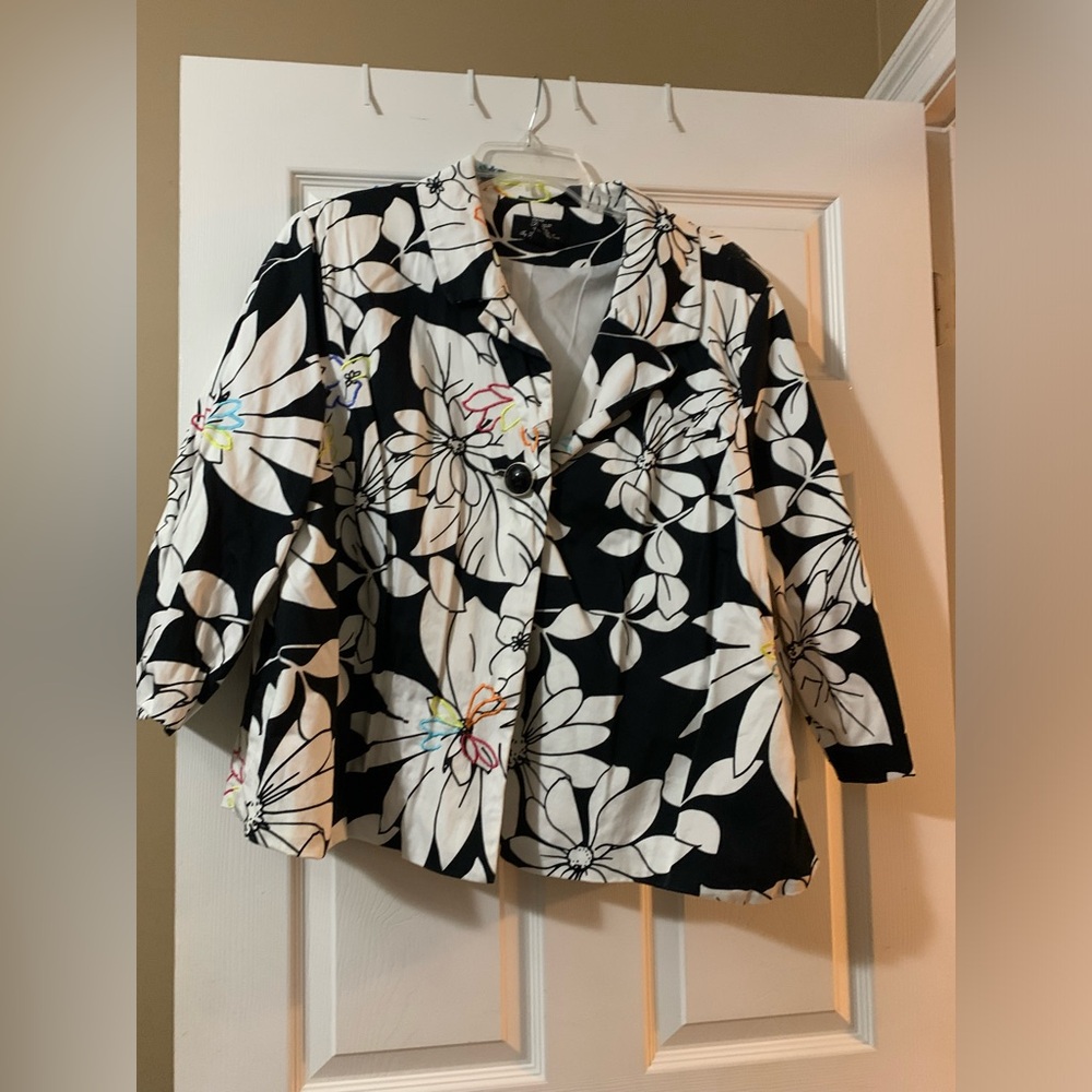 Black and white jacket with a pop of color.